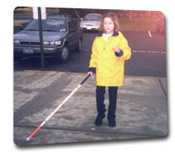 Young student walking independently with cane